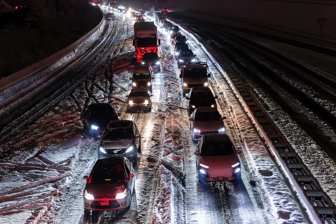 Photo of cars in traffic in the snow