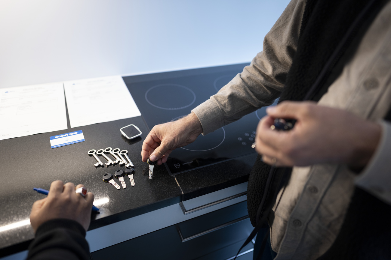 Photo of a person handing in house keys