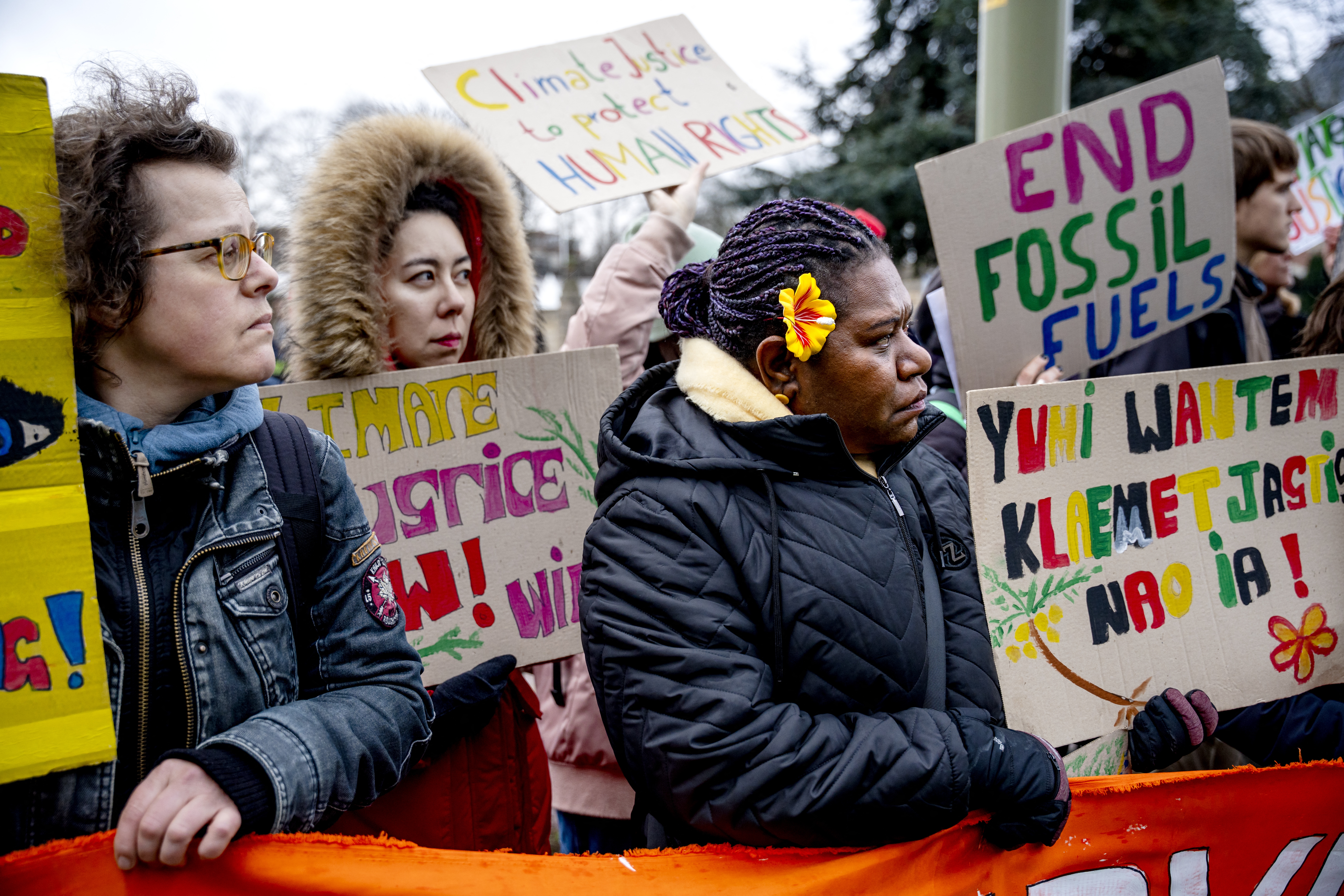 Climate protesters outside the International Court of Justice in The Hague on December 2, 2024.