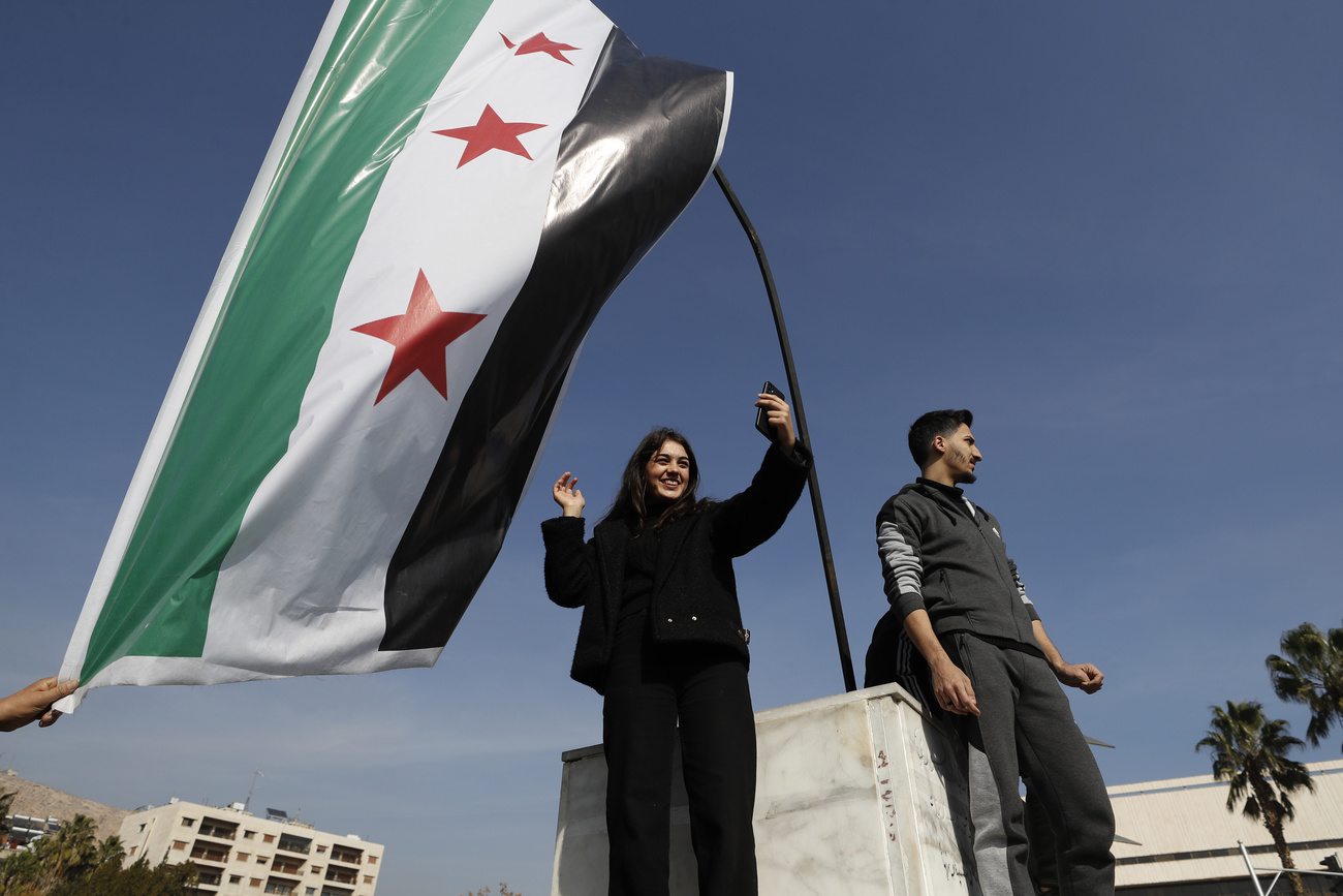 Syrians celebrate at Umayyad Square in Aleppo