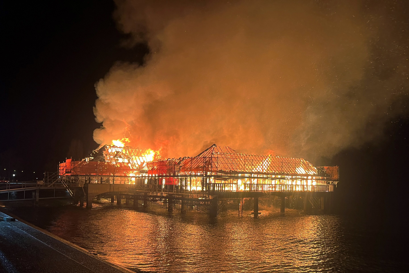 A fire has destroyed the 100-year-old Badhütte (swimming hut) in Rorschach, an iconic public bathhouse on stilts along the Swiss shore of Lake Constance. The Badhütte, a local institution with a restaurant and a popular gathering spot for all generations, went up in flames in the early hours of the morning. "This is a catastrophe for Rorschach and its population," said Mayor Robert Raths.