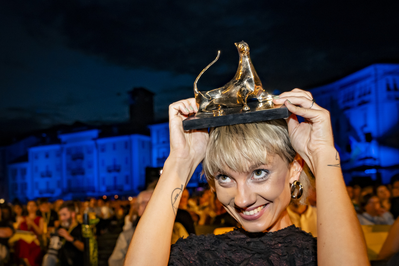 Lithuanian director Saule Bliuvaite poses with her Giolden Leopard award at Locarno's Piazza Grande, last August.