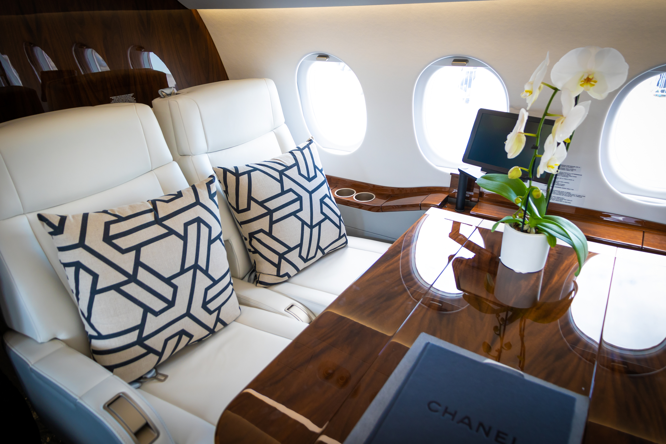 Interior cabin view of the modern Dassault Falcon 2000S business jet at the Paris Air Show.