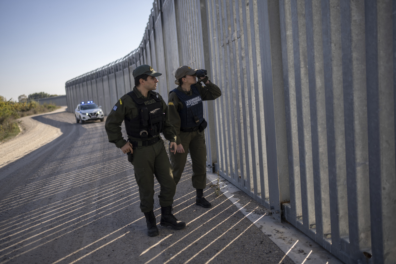 Border guards at a fence