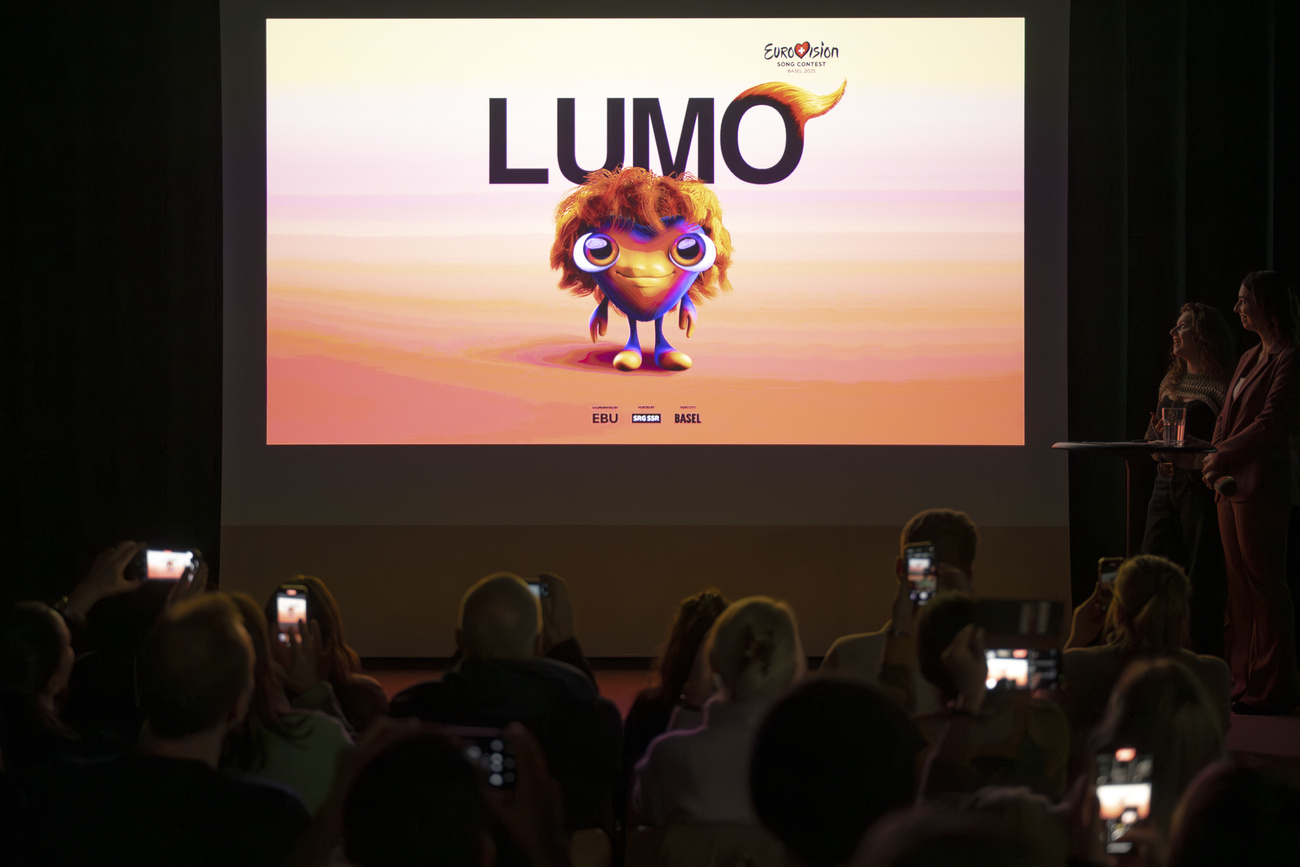 mascotte Eurovision song contest presentata in una sala su uno schermo