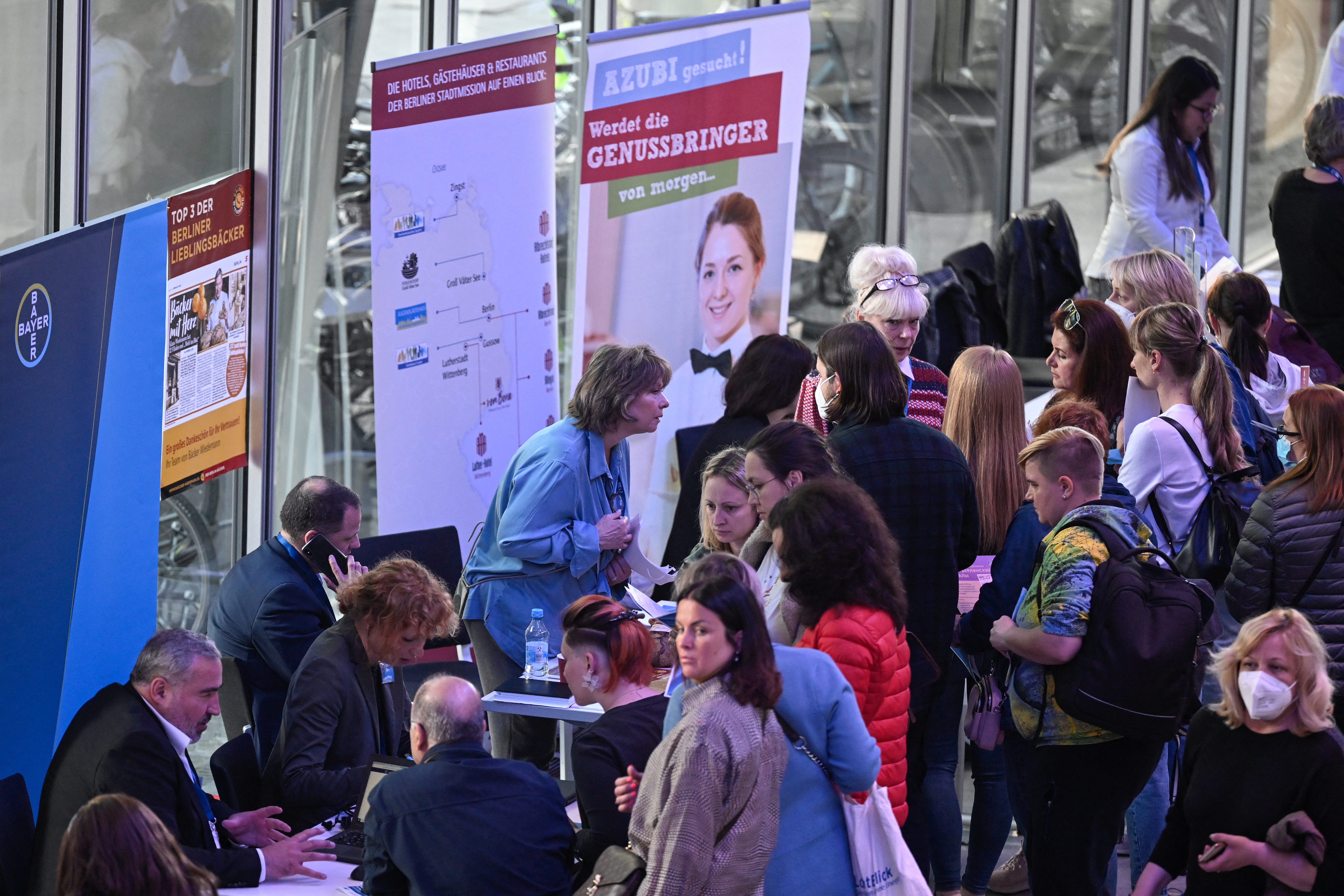 Job fair booths full of interested job seekers