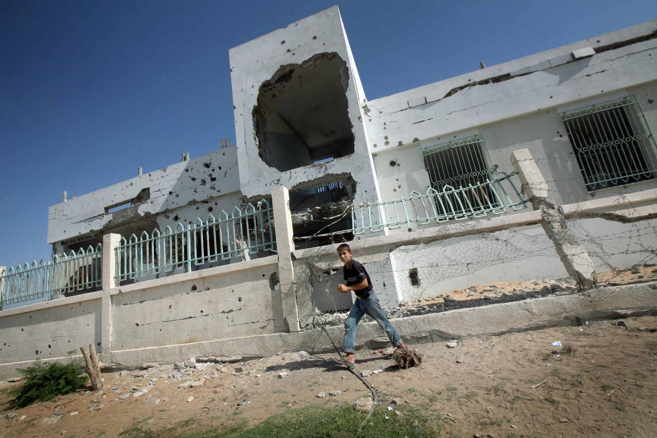 A Palestinian youth strides past a house which was destroyed during Israel's three-week offensive in Gaza earlier this year, at Bait Lahiya in northren Gaza Strip on 16 September 2009. Justice Richard Goldstone, Head of the UN Fact Finding Mission on the Gaza Conflict, releases the panel's findings in the UN Fact Finding Report during a news conference at the United Nations in New York in 15 September. The report says ,Israel violated international humanitarian law and used disproportionate force during its assault on the Gaza Strip eight months ago,