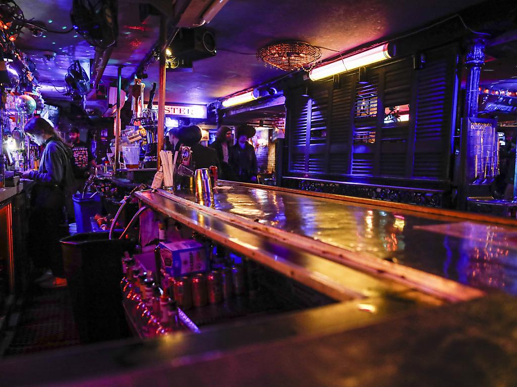 Bars close early in New York and Greece goes under curfew