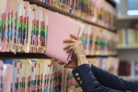 taking files from a filing shelf